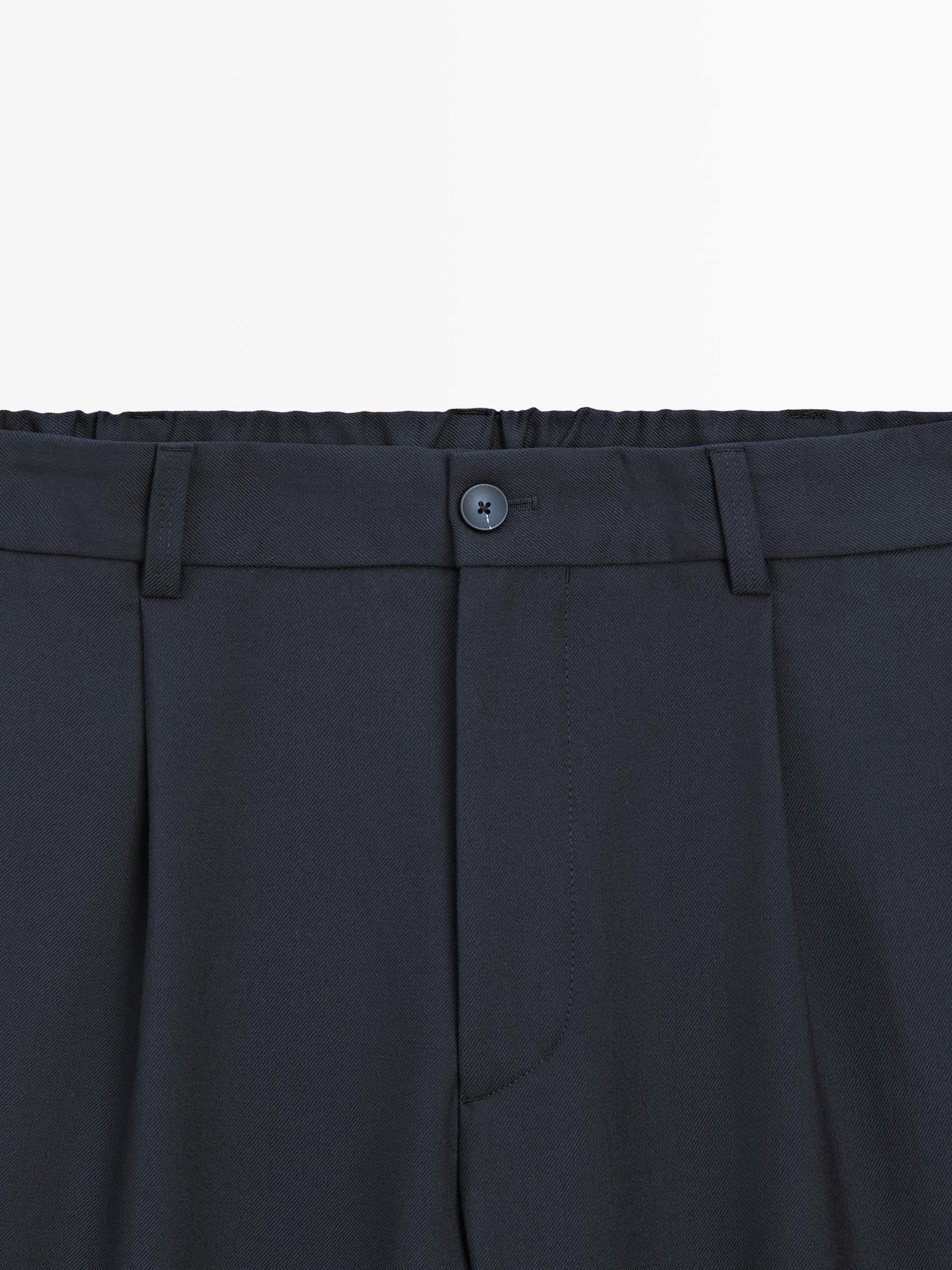 Relaxed fit darted wool blend trousers